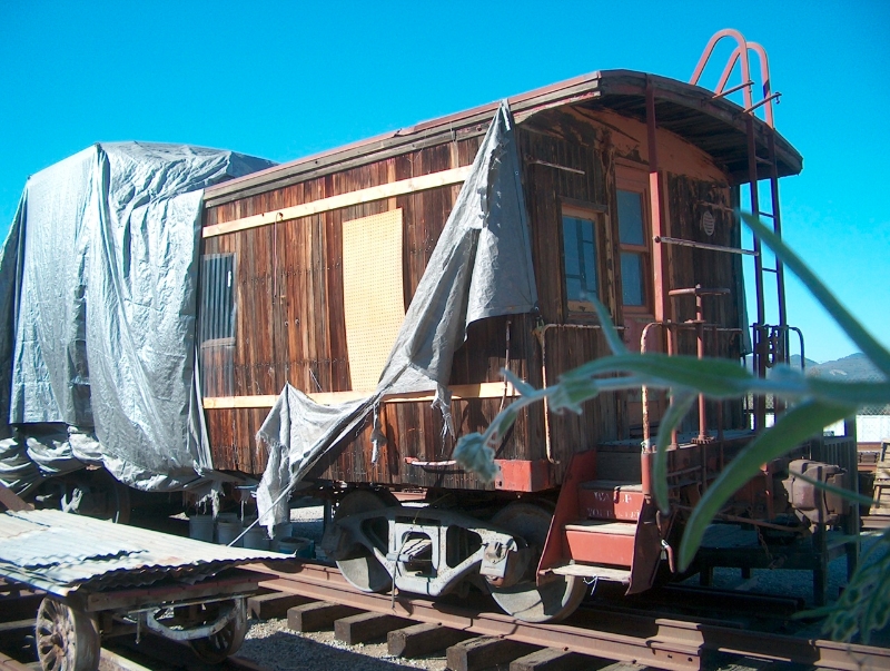 photo Caboose 244 with torn tarp covering