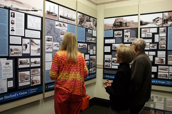 photo of people looking at exhibit